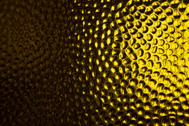istock Corrugated drops golden glass refraction surface 1433100535