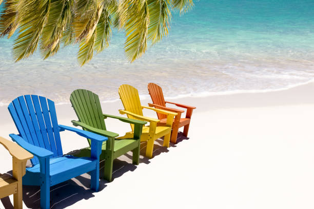 istock Colorful wooden chairs on white sand beach 1433101153