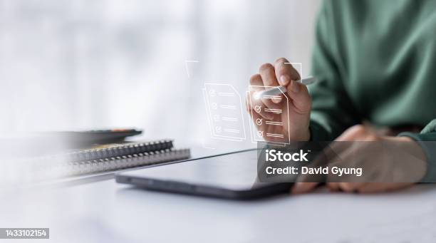 Businesswoman Working On A Laptop Computer To Document Management Online Documentation Database Digital File Storage System Software Records Keeping Database Technology File Access Doc Sharing Stock Photo - Download Image Now