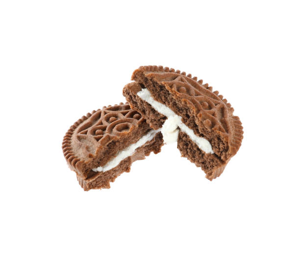 istock Broken tasty chocolate sandwich cookie with cream on white background 1433104147