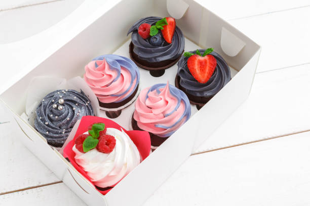 istock delicious cupcakes on a colored background. Festive background, birthday 1433105700