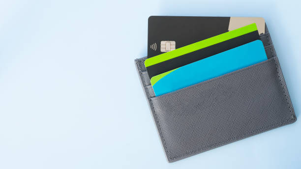 Bank cards in a wallet on a light blue background