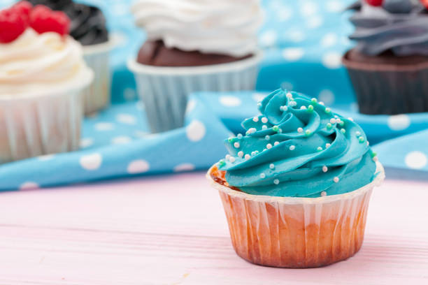 Cupcakes decorated with sprinkles and frosting - close up