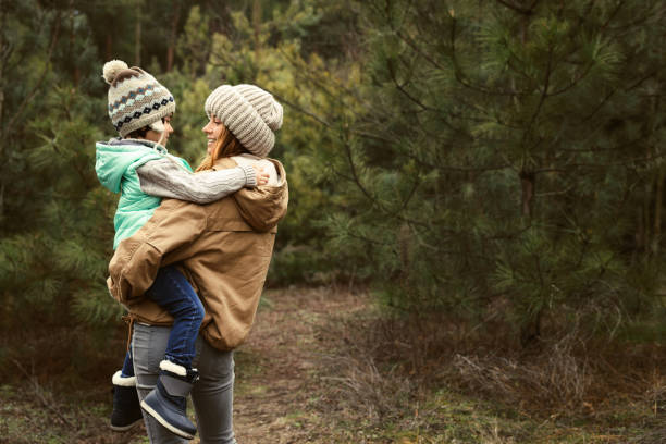 istock Woman and her son spending time together in forest 1433107723