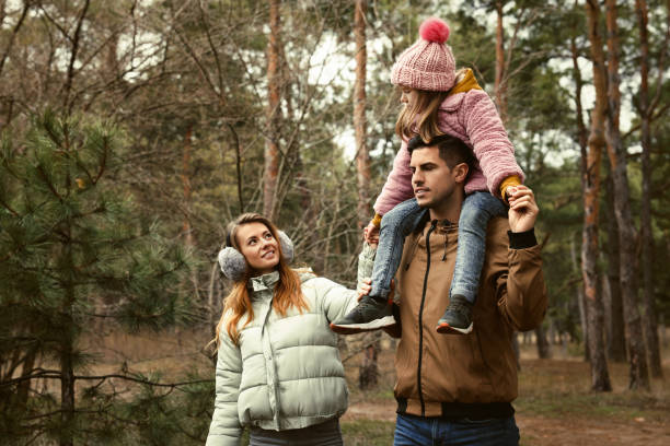 istock Happy family spending time together in forest 1433107761