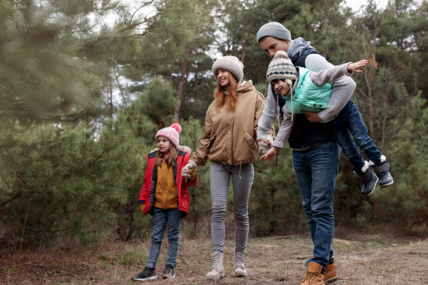 istock Happy family spending time together in forest 1433107890
