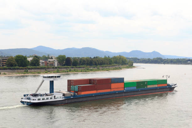 istock Container ship on river Rhine (Rhein) in Bonn, Germany 1433108080
