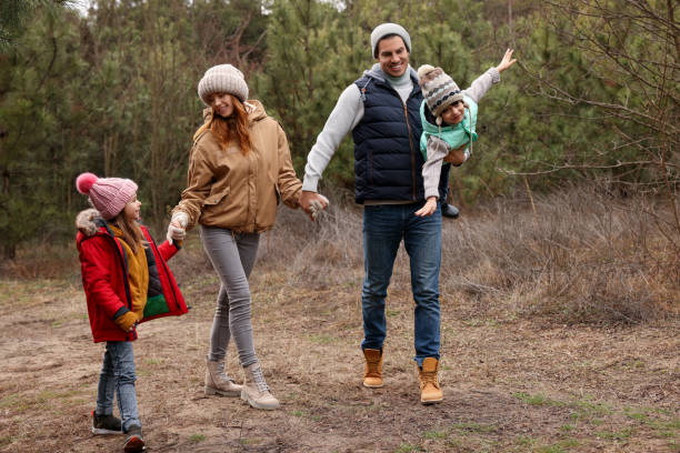 istock Happy family spending time together in forest 1433108506