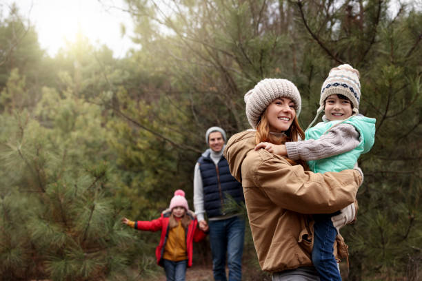 istock Happy family spending time together in forest 1433108507