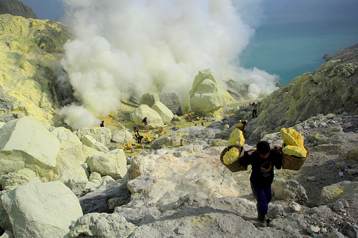 Banyuwangi, Indonesia, May 27, 2015. Sulfur miners in Ijen crater. The crater predicted to produce more than 36 million cubic meters of hydrogen chloride and sulfur with an area of 5000 Ha.