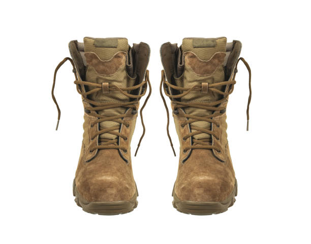 Modern army combat boots. New desert beige shoes. Isolate on a white background. Modern army combat boots. New desert beige shoes. Isolate on a white background. leather white hide textured stock pictures, royalty-free photos & images