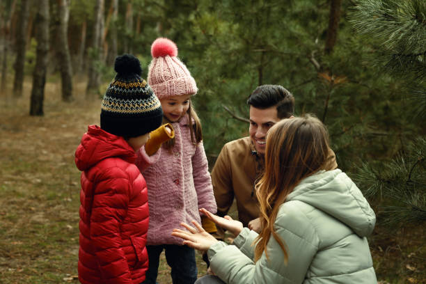 istock Happy family spending time together in forest 1433110388