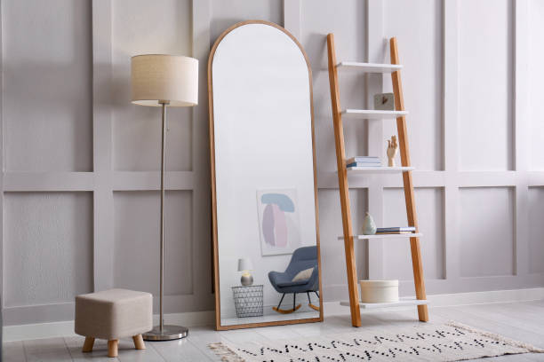 istock Large mirror near white wall in light room 1433111587
