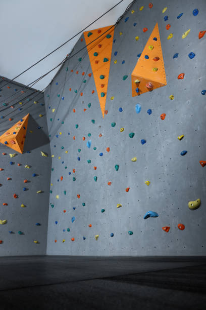 istock Climbing wall with holds in gym. Extreme sport 1433111711