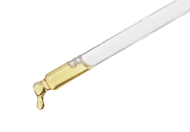 istock Dripping hydrophilic oil from pipette on white background 1433111749