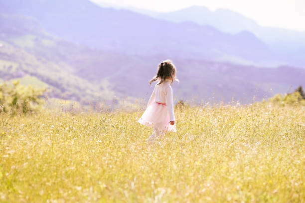 Free Stock Photo of Little Girl Standing in Yellow Flower Field ...