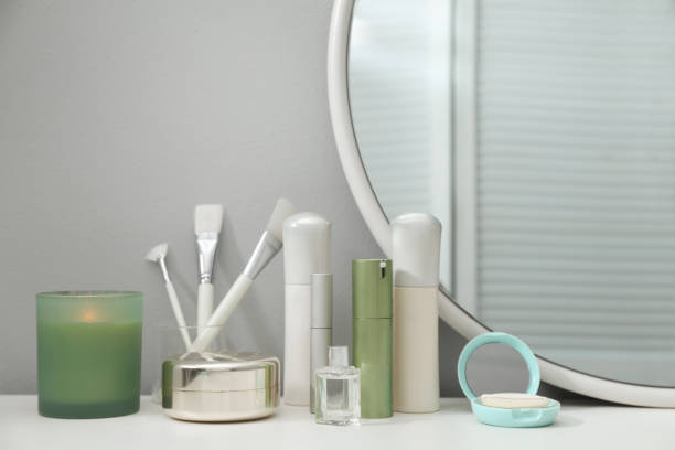 istock Stylish round mirror on dressing table with cosmetic products 1433115236