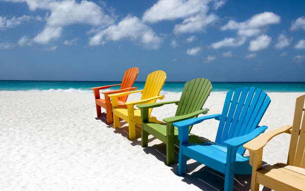 istock Colorful wooden chairs on white sand beach 1433115263