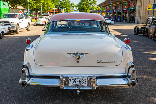 Falcon Heights, MN - June 19, 2022: High perspective rear view of a 1955 Chrysler Imperial 4 Door Sedan at a local car show.