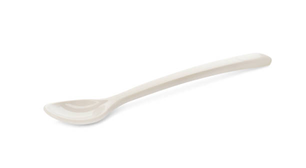 istock Plastic spoon isolated on white. Serving baby food 1433116294