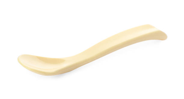 istock Plastic spoon isolated on white. Serving baby food 1433116307