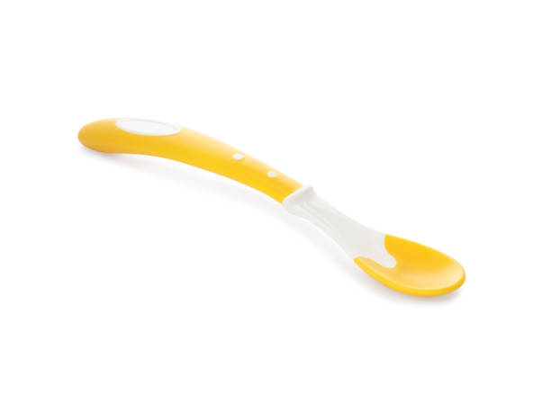 istock Plastic spoon isolated on white. Serving baby food 1433116488