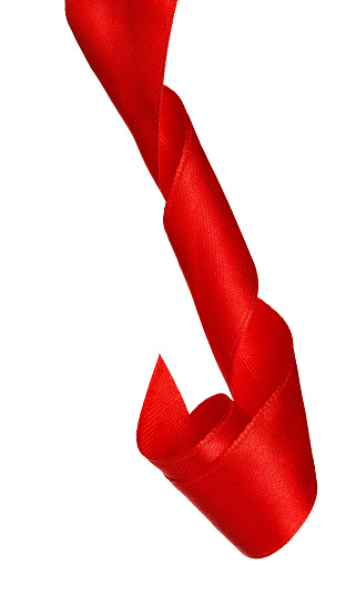 Curly vertical red ribbon isolated on white background