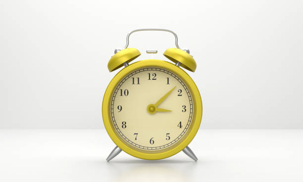 istock Yellow Alarm Clock On Gray Background 1433119102