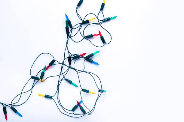 istock Garland of multi-colored light bulbs on a white background. Top view, flat lay 1433124478