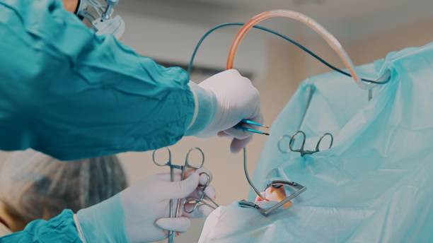 istock Doctor does an oral surgery 1433125678
