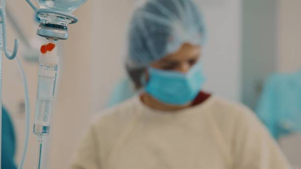 istock Medical IV drip with liquid medicines - The drip which is filled with a saline solution that also contains vitamins, minerals or medications 1433125947
