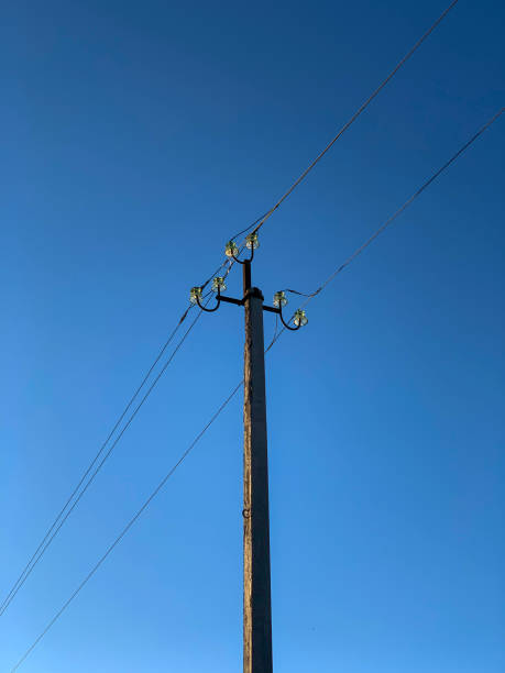 istock Electric pole with cables against the sky 1433126520