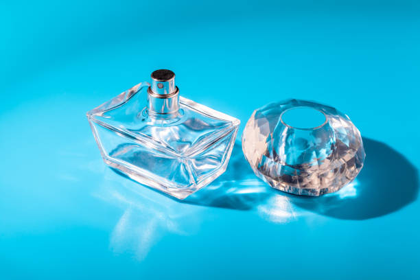 istock perfume glass bottle on light blue background. Eau de toilette 1433127311