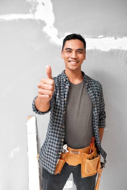 istock An attractive young Asian man gives thumbs up while doing home DIY improvements 1433127438