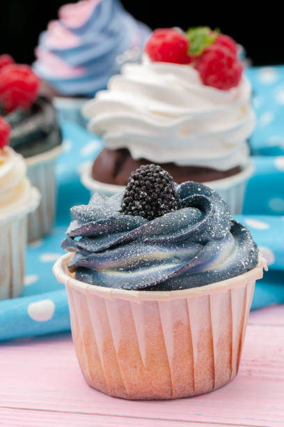 istock Cupcakes decorated with sprinkles and frosting - close up 1433132299
