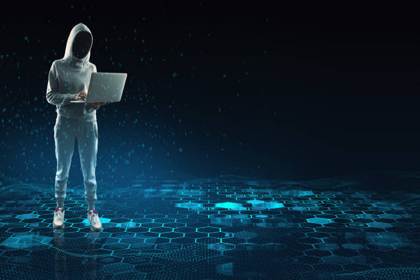 Hacker with laptop and mock up place with creative blue hexagonal background. Technology, hacking, design and landing page concept. stock photo