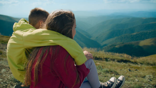 istock Young guy and young girl sitting together 1433136190
