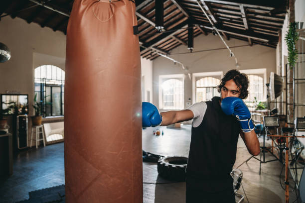istock A man is training at the gym with a punching bag 1433136842