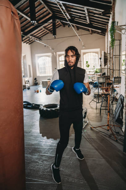 istock A man is training at the gym with a punching bag 1433136850