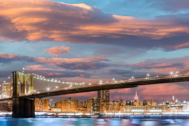 new york, brooklyn bridge and manhattan at twilight - connection usa brooklyn bridge business imagens e fotografias de stock