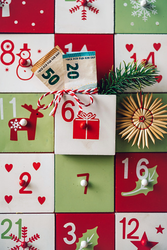 Original Christmas Advent Calendar in an old wooden drawer on wooden table