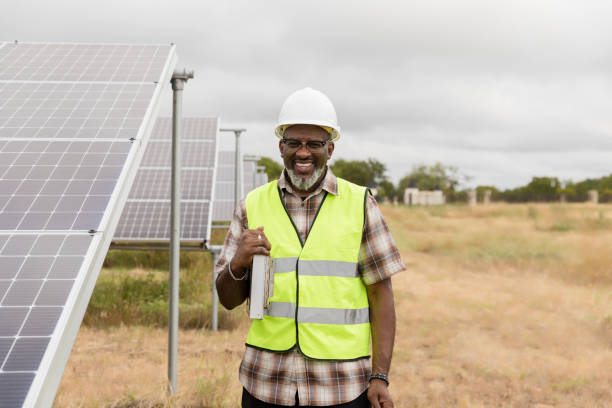 istock At solar farm, male engineer takes break for photo 1433143238