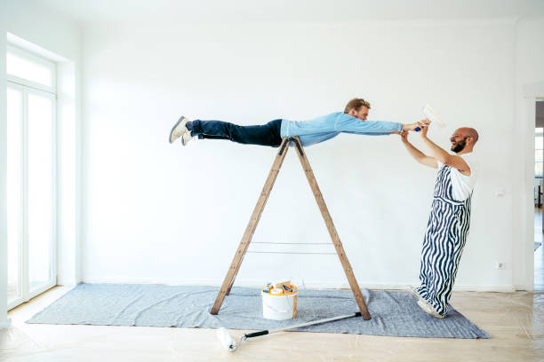 istock Male couple having a great time during house renovation 1433147309