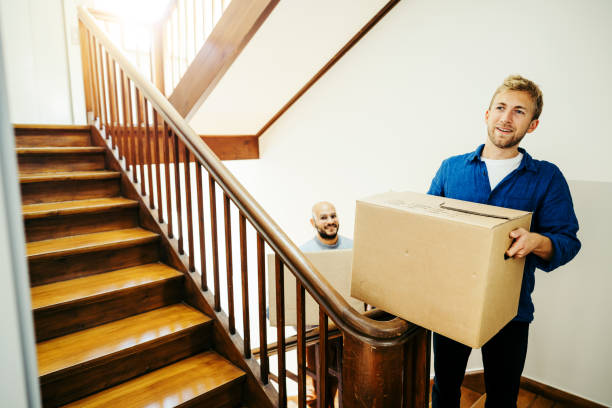 istock Two men friends moving into a new apartment 1433147617