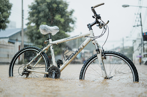 Bicycle in Flood Rain Water in Chiang Mai, Thailand