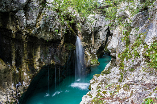 Small waterfalls over the blue water of soca river canyon in Slovenia