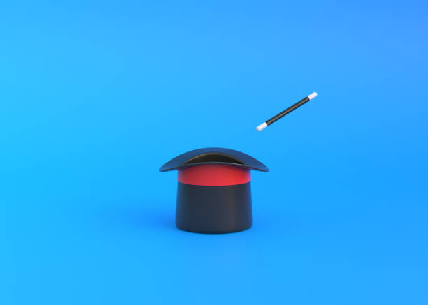 istock Magician hat with red ribbon and magic wand on a blue background 1433151248