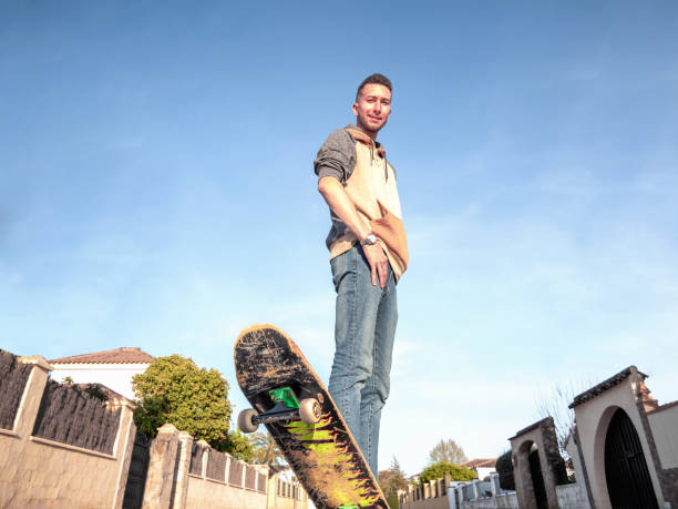 istock Young man posing with a skateboard in the street. Selective focus 1433151336
