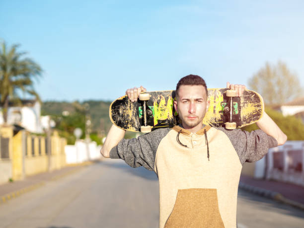 istock Young man posing with a skateboard in the street. Selective focus 1433151338