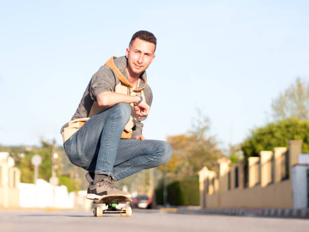 istock Young man posing with a skateboard in the street. Selective focus 1433151342